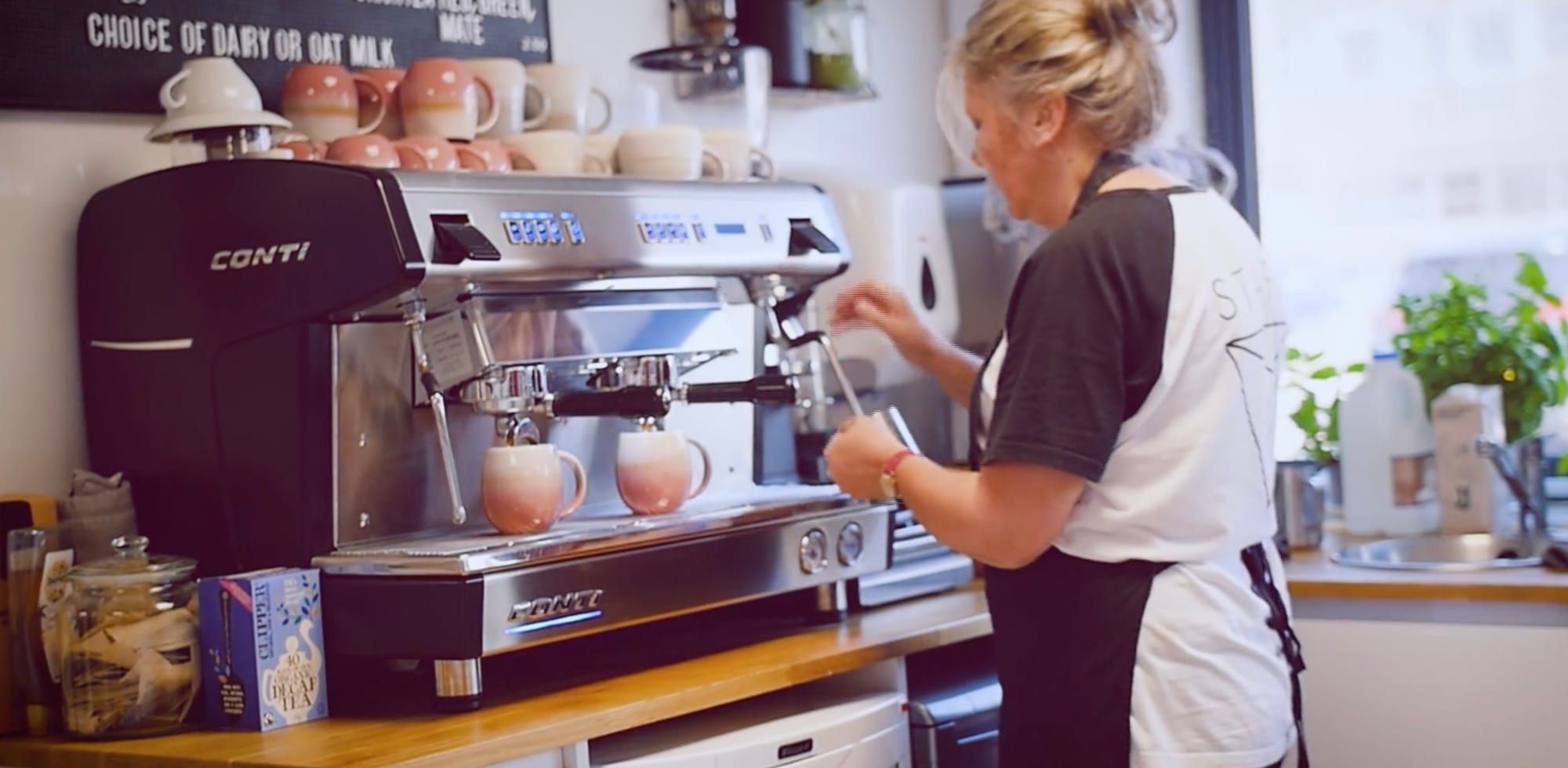 Barista making coffee at Jacob's Bagels