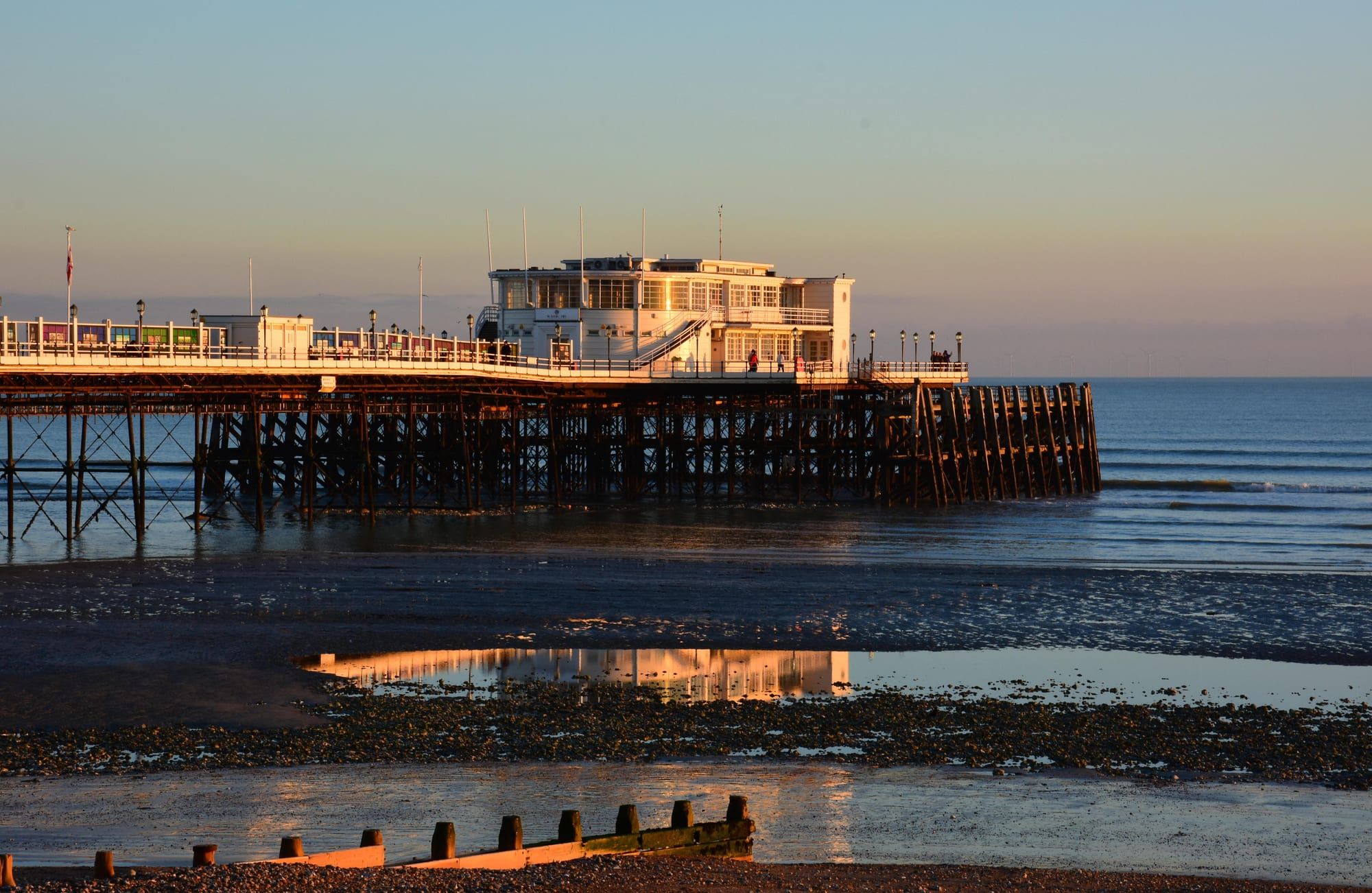 Worthing Pier at sunset, a short walk from Jacob's Bagels